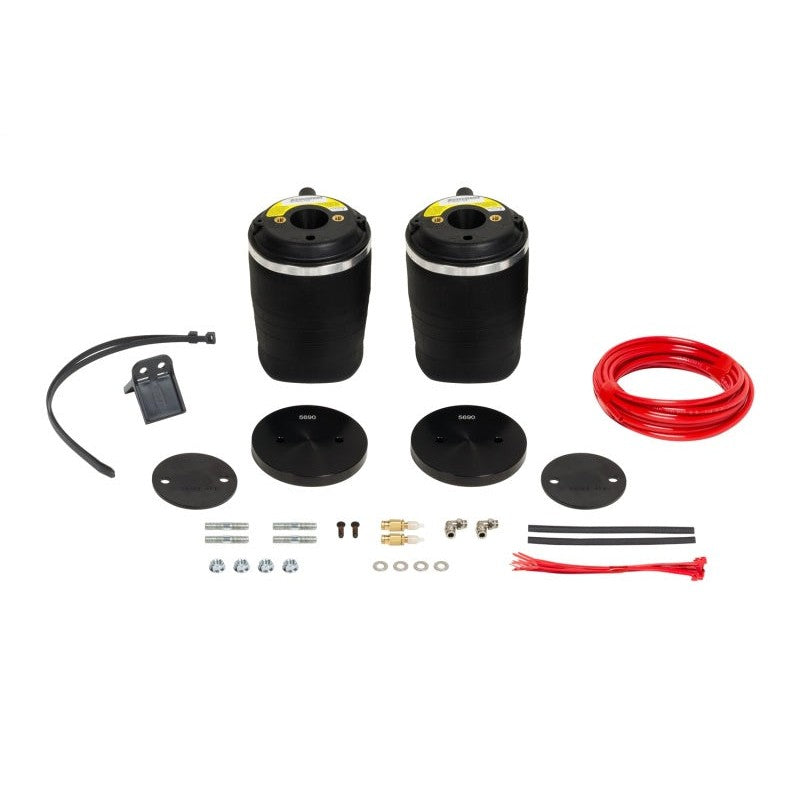 Firestone Ride-Rite rear air spring kit with two rubber bellows, steel mounting brackets, and air lines.