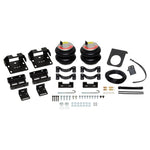 Firestone Ride-Rite RED Label heavy-duty air helper springs with vehicle-specific mounting brackets and hardware.