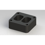 Fleece Performance 1.5-inch T4 turbo pedestal spacer in a black finish for GM Duramax engines.