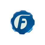 Blue anodized billet aluminum oil cap cover with laser-etched Fleece Performance logo.