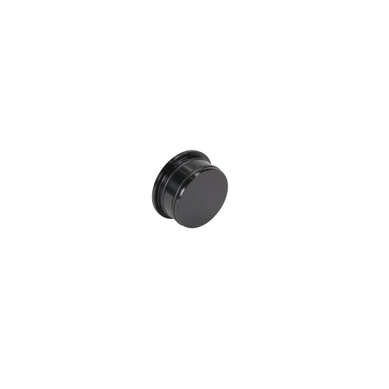CNC machined billet aluminum turbo resonator delete plug for 6.6L Duramax diesel engines.