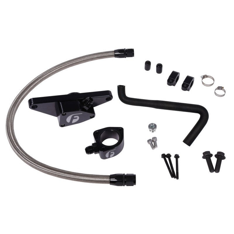 Fleece Performance Cummins coolant bypass kit featuring stainless steel braided hose, secondary thermostat, and brackets.