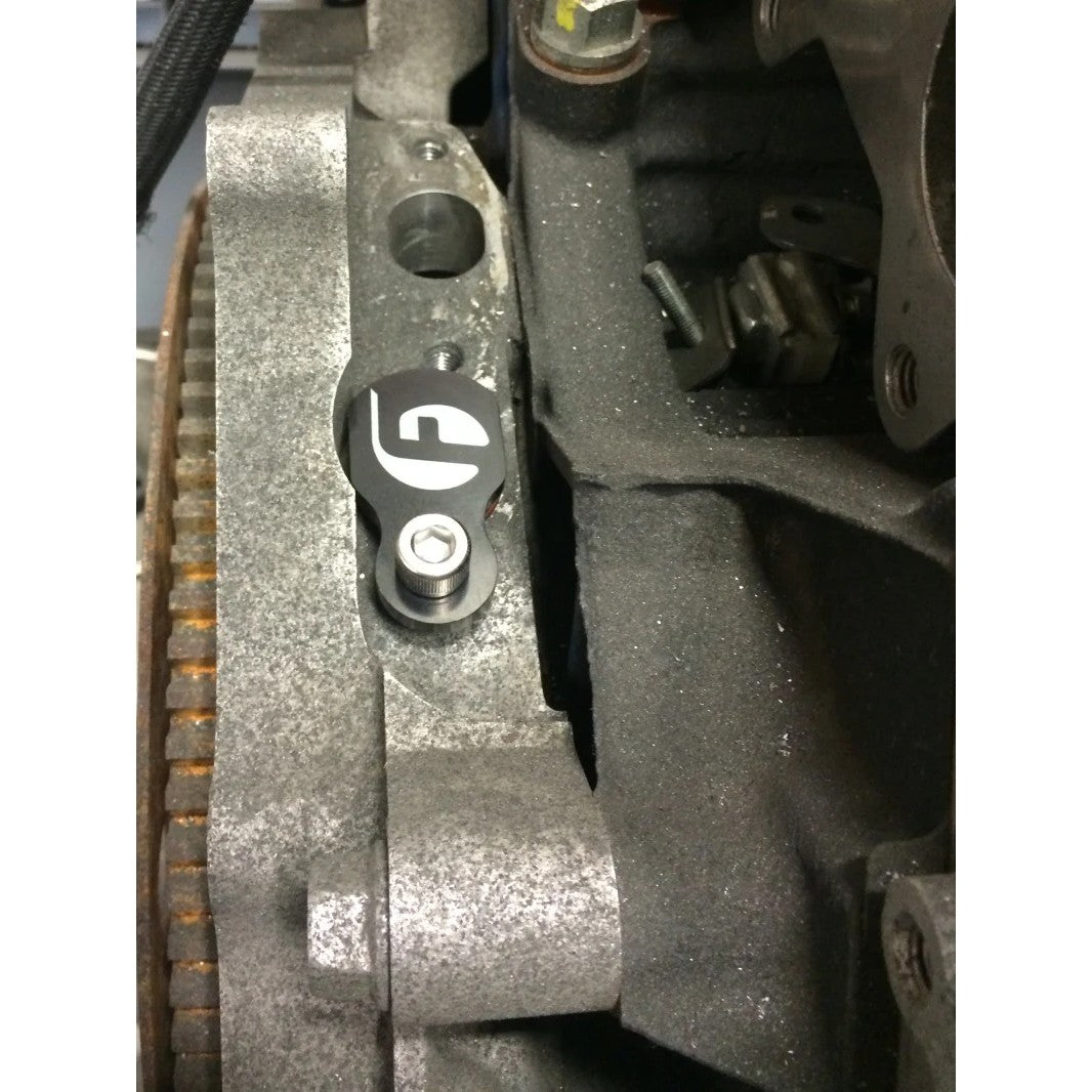 Black anodized billet aluminum coolant return plug with laser-etched Fleece logo and high-temp silicone O-ring.