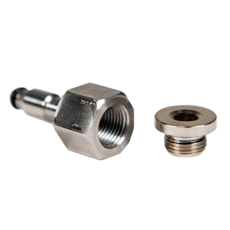 Machined metal return fuel pressure test port fitting for 2011-2016 GM LML Duramax engines.