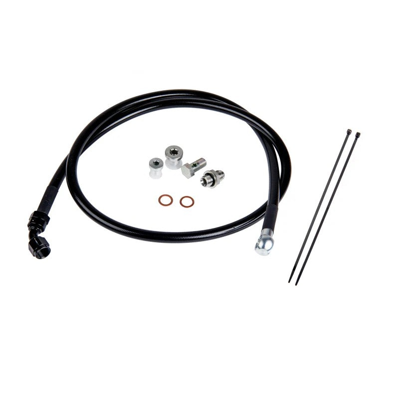 Fleece Performance remote turbo oil feed line kit with Teflon hose, AN fittings, and galley plugs for 6.6L Duramax engines.