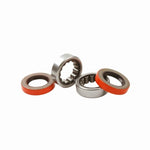 Ford Racing M-1225-B1 axle kit featuring two steel outer shaft bearings and two black rubber seals.