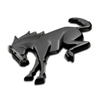 Matte black Ford Racing Bronco rear emblem with pre-applied adhesive backing.