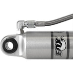 Fox 2.0 Performance Series remote reservoir rear shock with clear-anodized aluminum body and reservoir mounting clamp.
