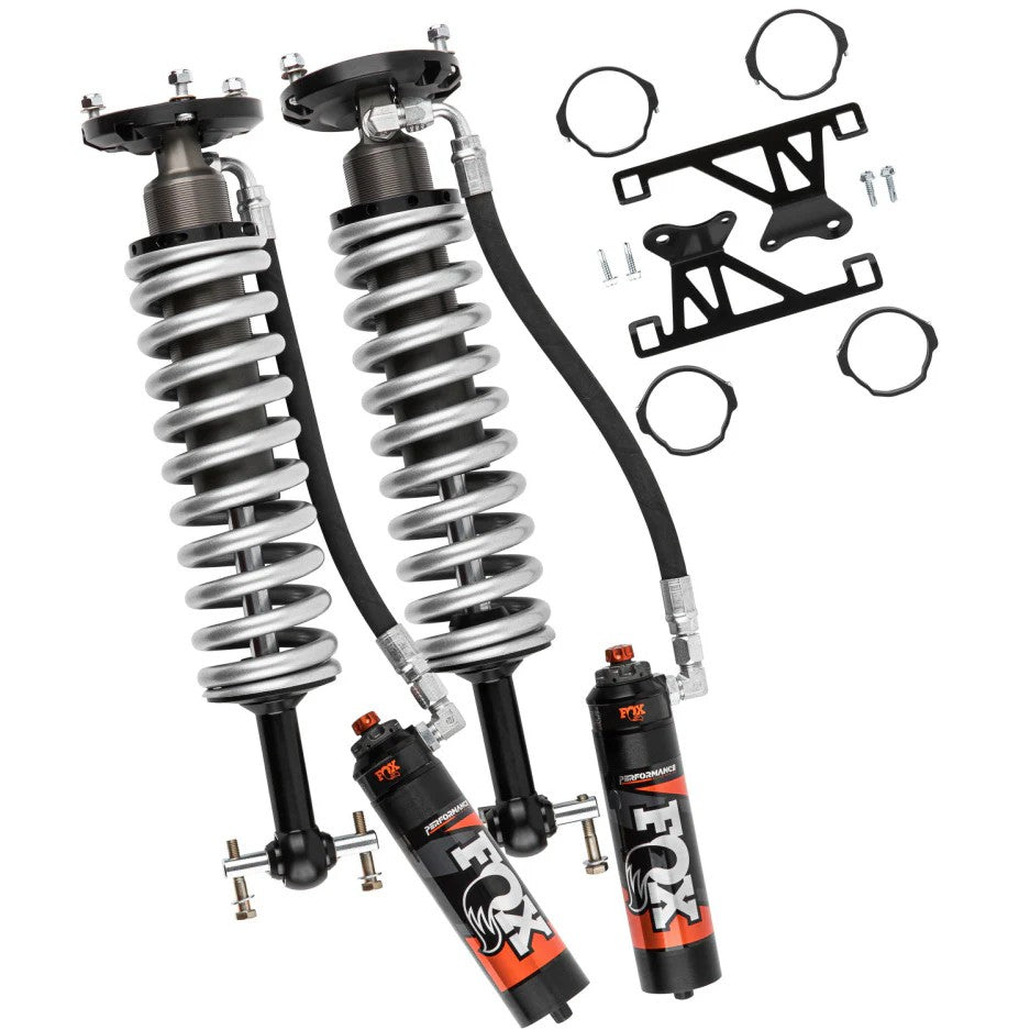 Fox 2.5 Series Performance Elite front remote reservoir coilover shock with black anodized mounting hardware.