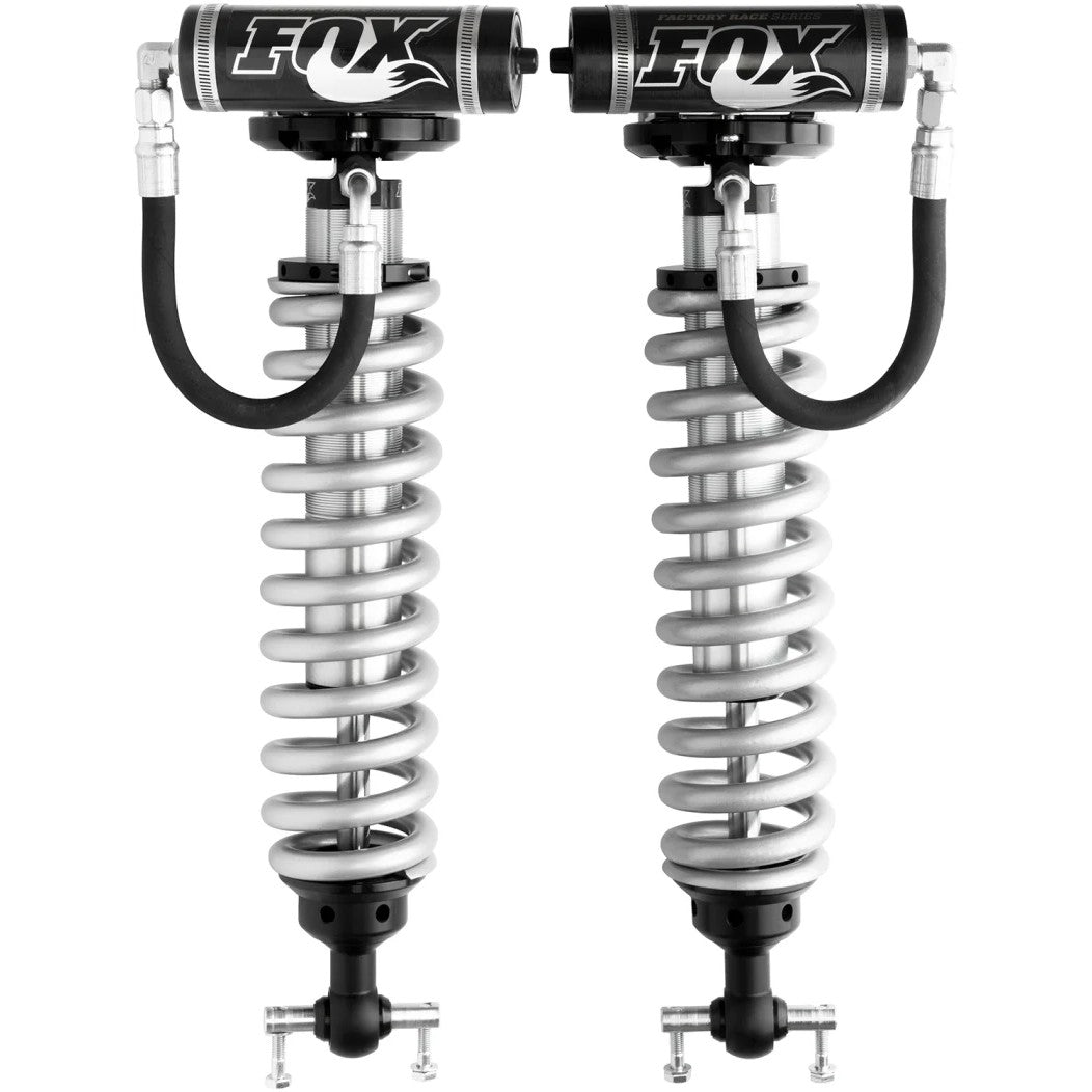 Fox Factory Series 2.5 front remote reservoir coilovers for Ford F-150 with zinc-plated bodies and black springs.