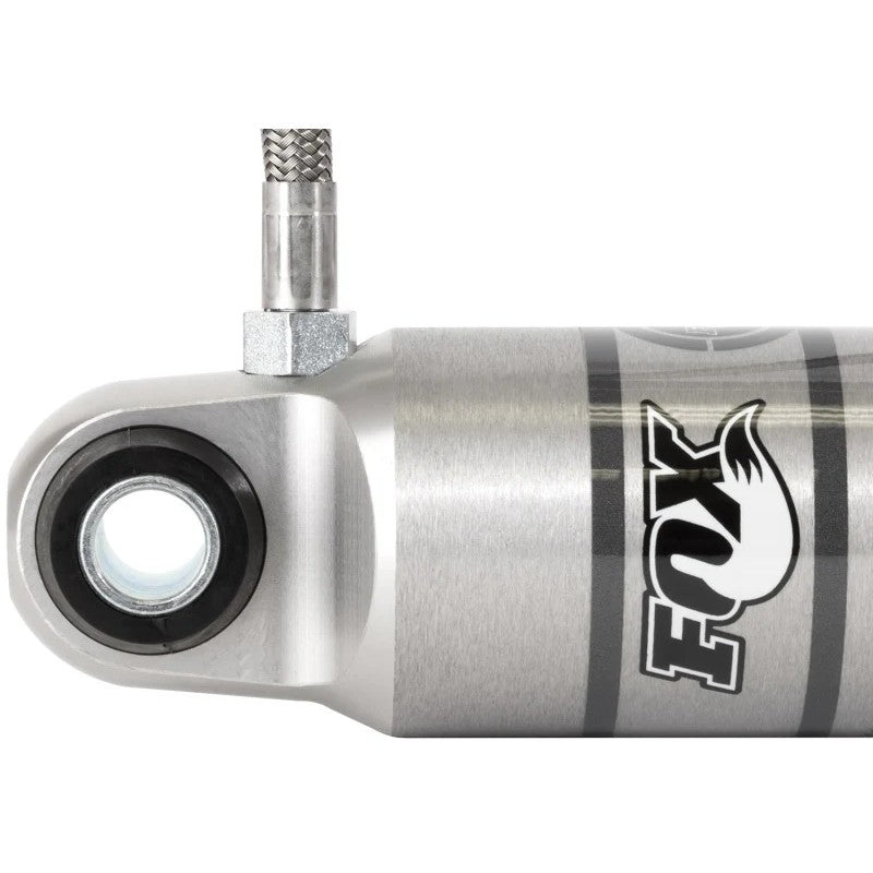 Fox 2.0 Performance Series remote reservoir rear shock with aluminum body and reservoir clamp for Dodge Ram trucks.
