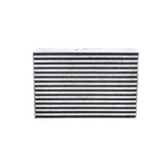 Garrett bar-and-plate air-to-air intercooler core with raw aluminum finish and visible internal cooling fins.