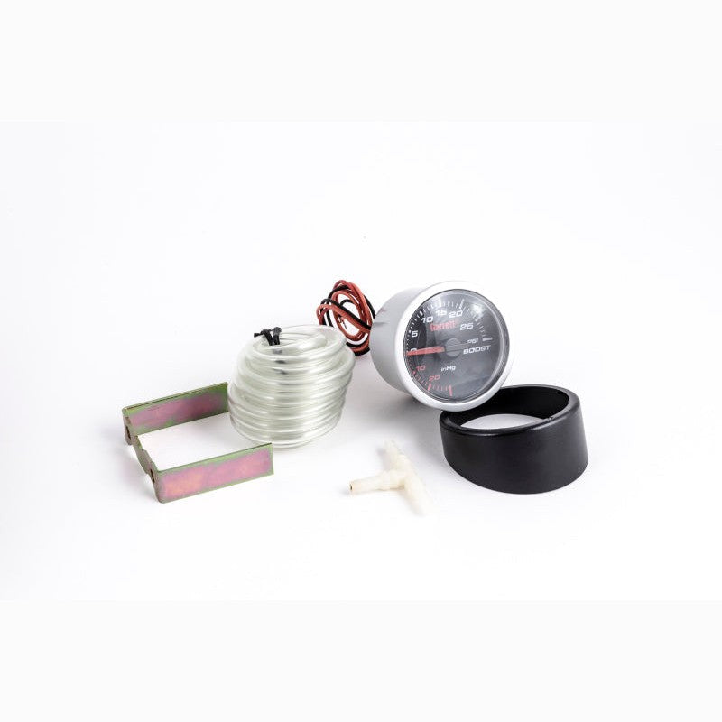 Garrett mechanical boost gauge with black face and white PSI markings for turbocharged engines