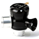 GFB Hybrid TMS 33mm Dual Port blow-off valve featuring a black body, brass piston, and adjustable venting ports.