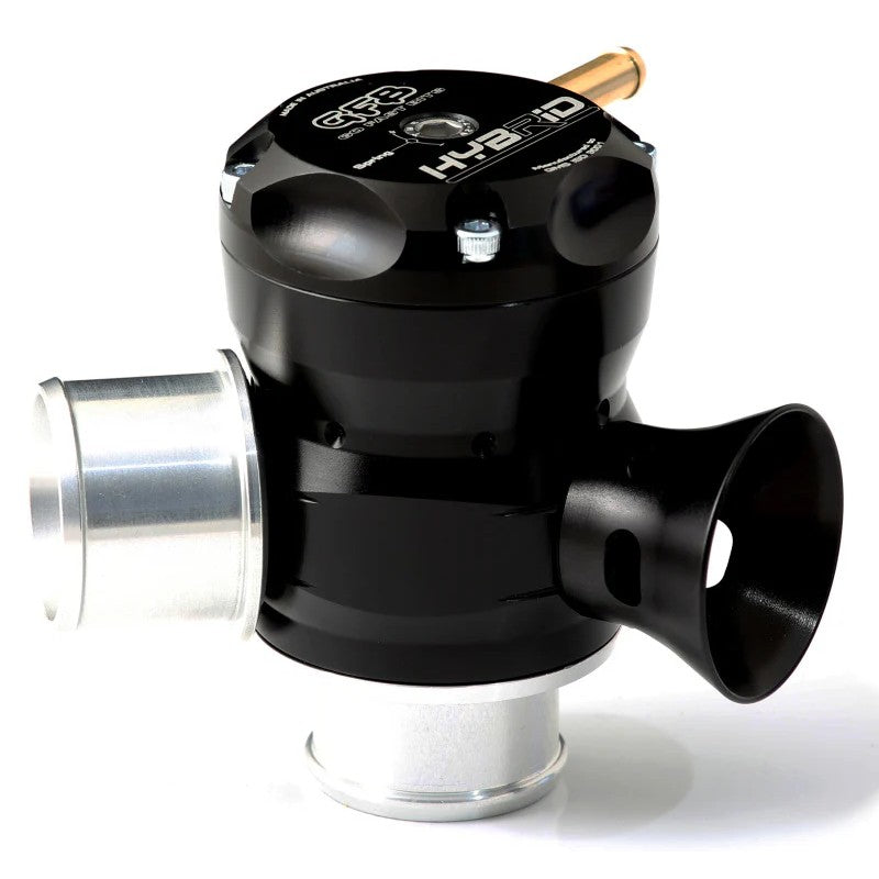 GFB Hybrid TMS 33mm Dual Port blow-off valve featuring a black body, brass piston, and adjustable venting ports.