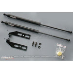 GReddy engine hood lifter kit with gas-charged dampers and mounting brackets for 1993-1995 Mazda RX-7 FD3S.