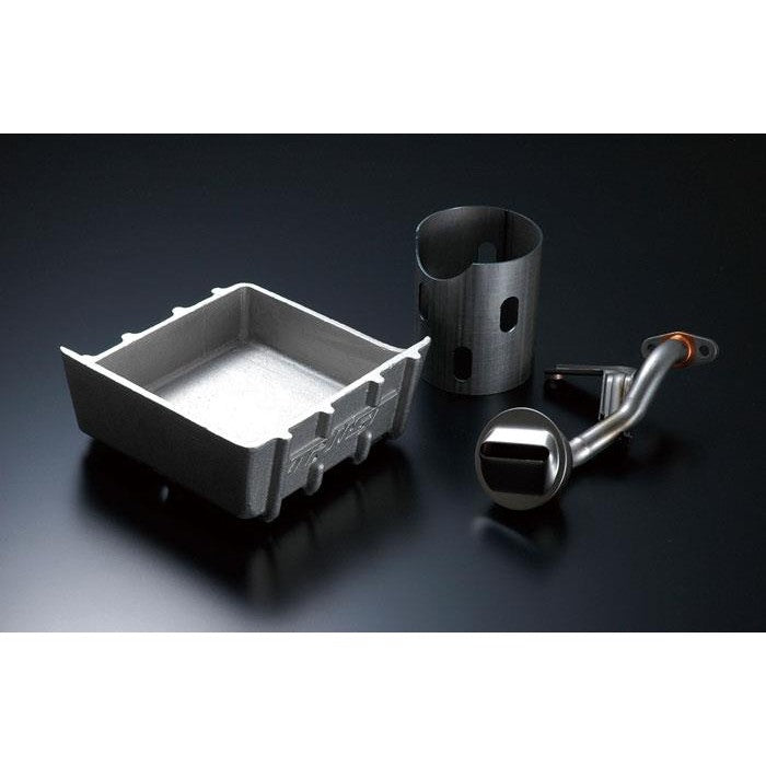 GReddy silver cast aluminum oil pan for RB26DETT featuring external cooling fins and internal baffles.