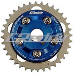 GReddy adjustable cam sprocket with blue anodized center and silver outer gear for Toyota 1JZ and 2JZ engines.