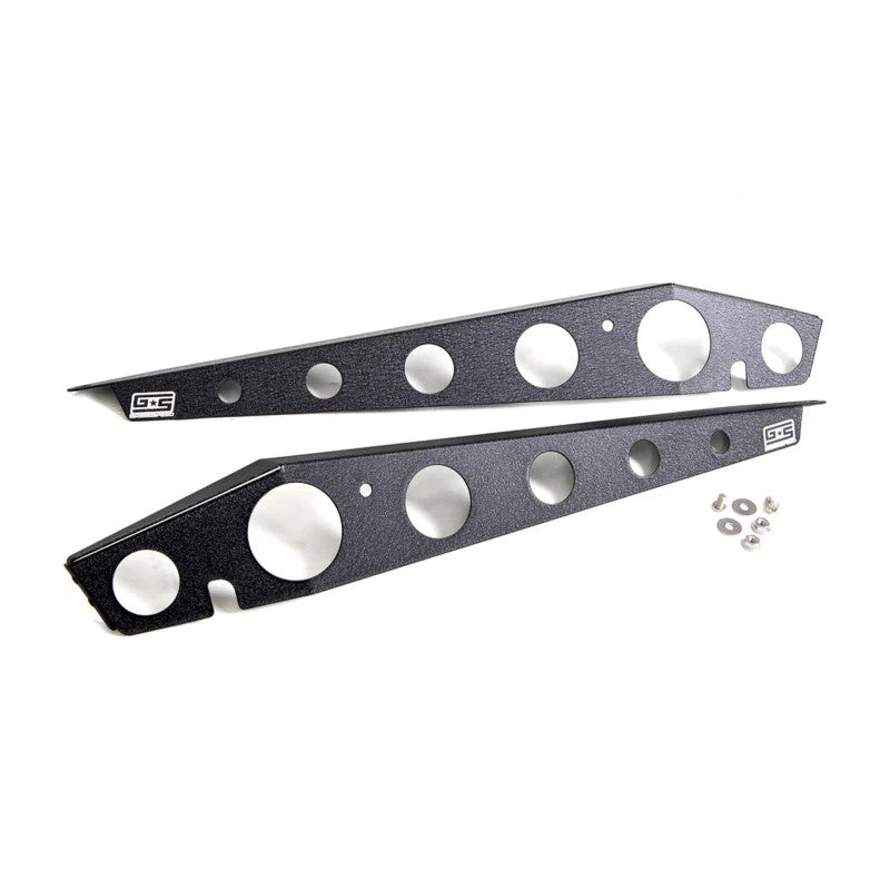 Pair of GrimmSpeed black powder-coated aluminum fender shrouds for 2015+ Subaru WRX and STI.