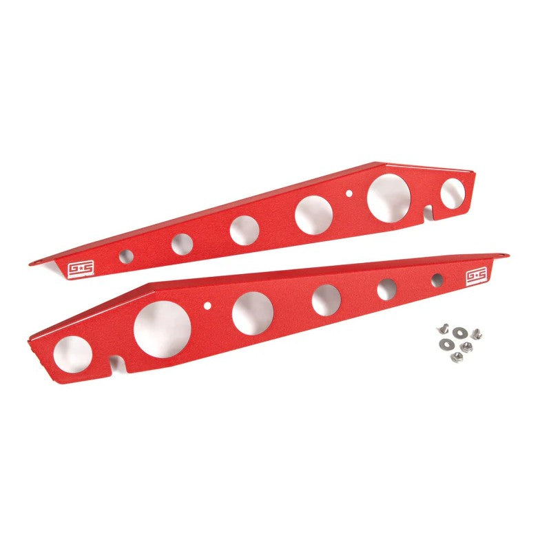 A pair of GrimmSpeed textured red powder-coated aluminum fender shrouds for the 2015-2021 Subaru WRX and STI.