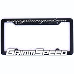 A pair of black GrimmSpeed license plate frames with white logo lettering for front and rear plates.