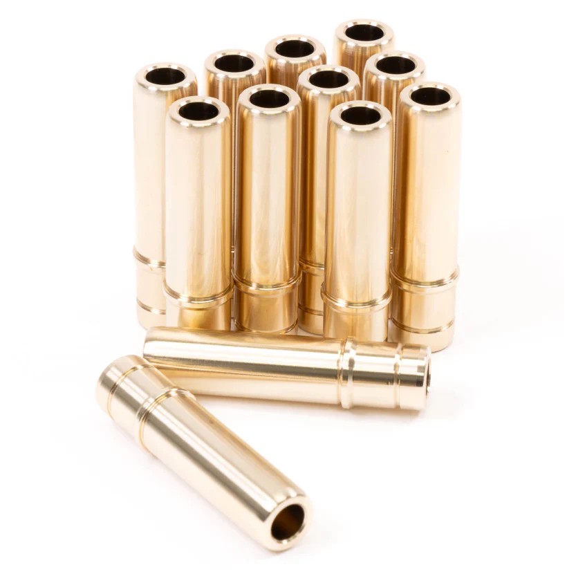 Set of 12 GSC Power-Division manganese bronze exhaust valve guides with integrated stoppers for BMW B58 and S58 engines.