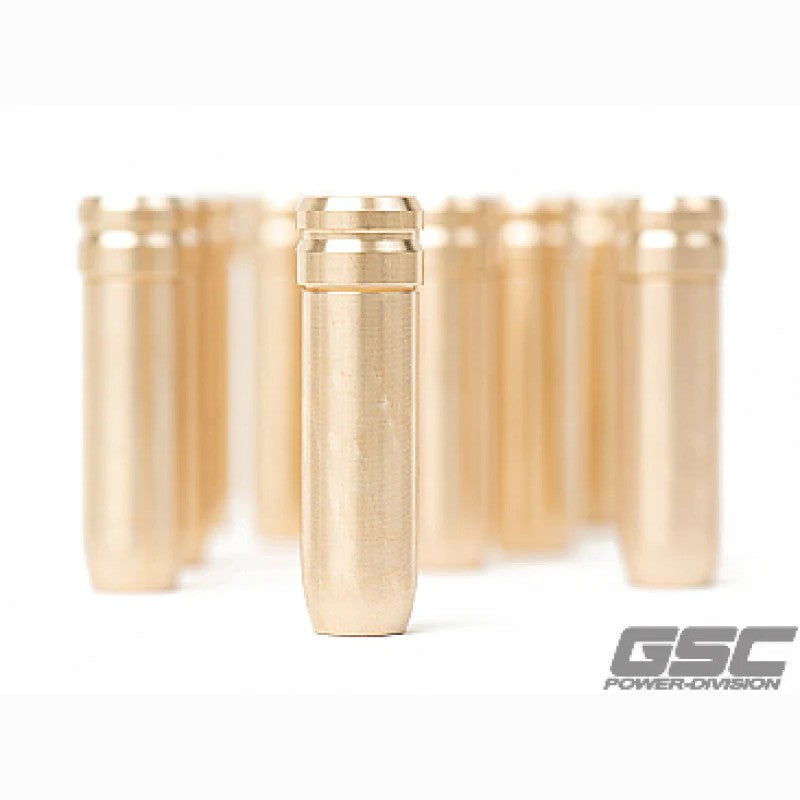 Set of twelve manganese bronze stopper-style exhaust valve guides for Toyota 2JZ engines.