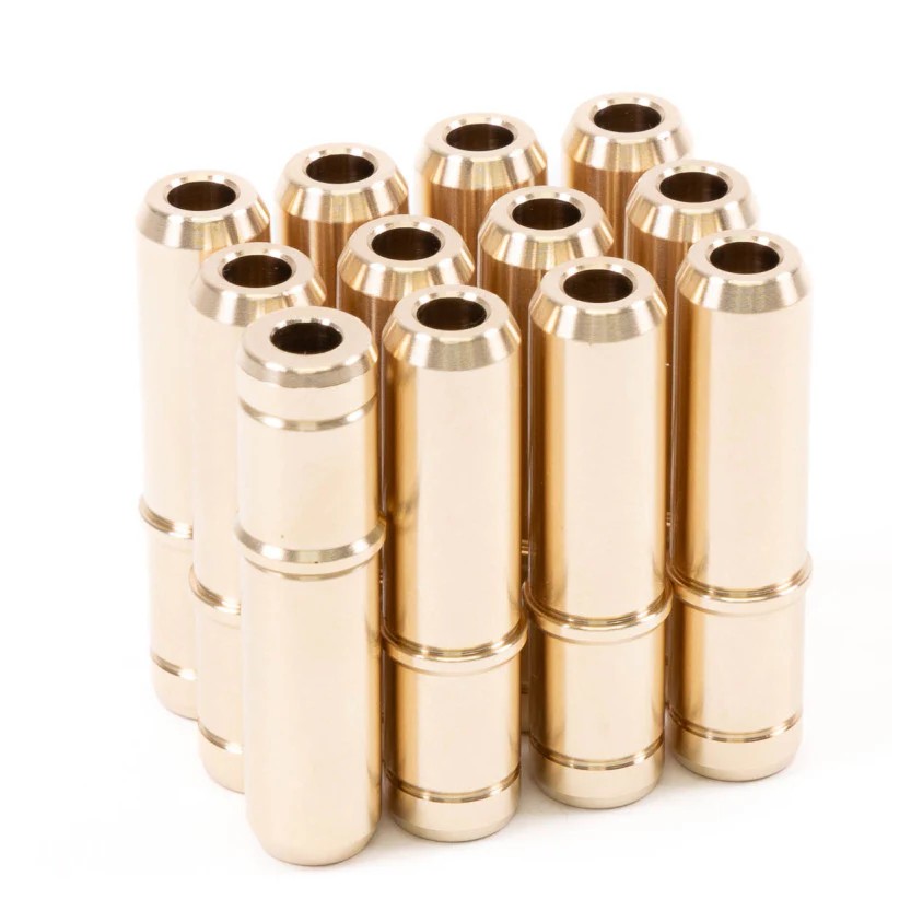 Set of 12 precision-machined GSC Power-Division manganese bronze intake valve guides with integrated stoppers.