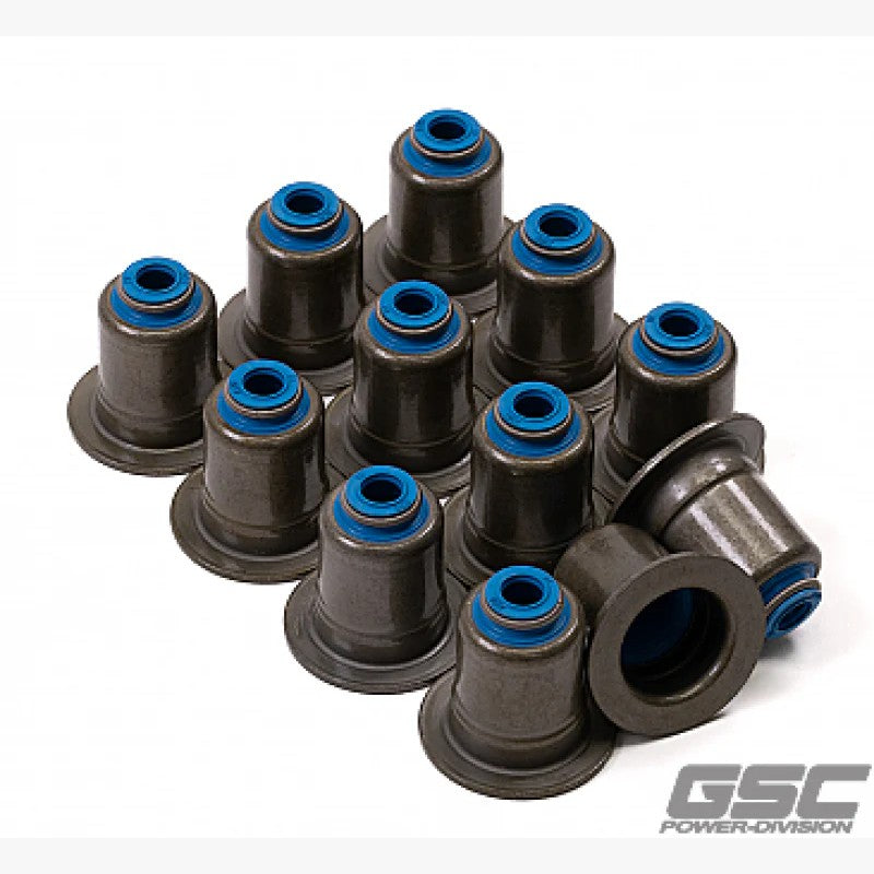 Set of 12 brown GSC Power-Division Viton exhaust valve stem seals for BMW and Toyota Supra performance engines.