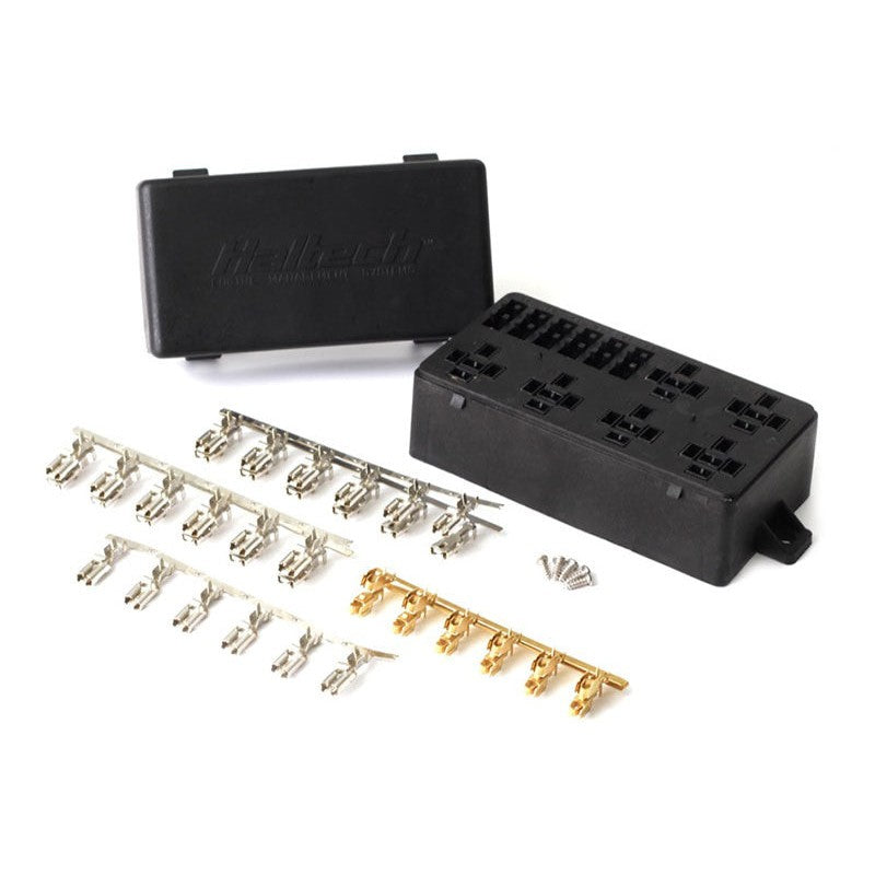 Haltech 6-circuit automotive fuse box with protective snap-on lid and metal terminal pins for custom wiring.