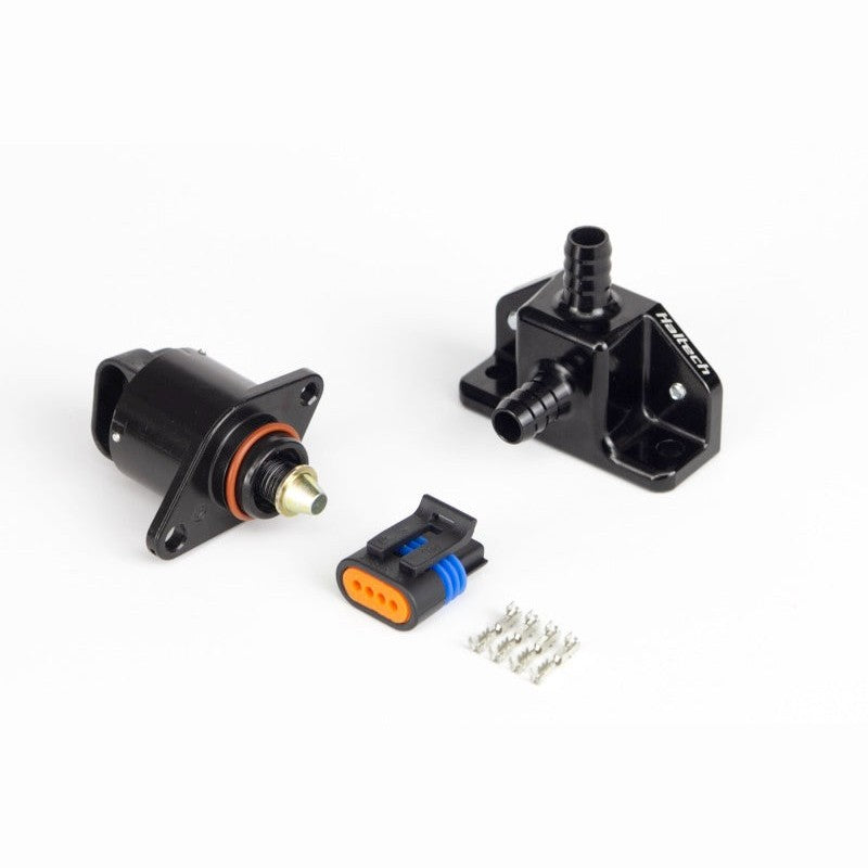 Haltech billet aluminum 2-port idle air control housing with 2-screw stepper motor and electrical connectors.