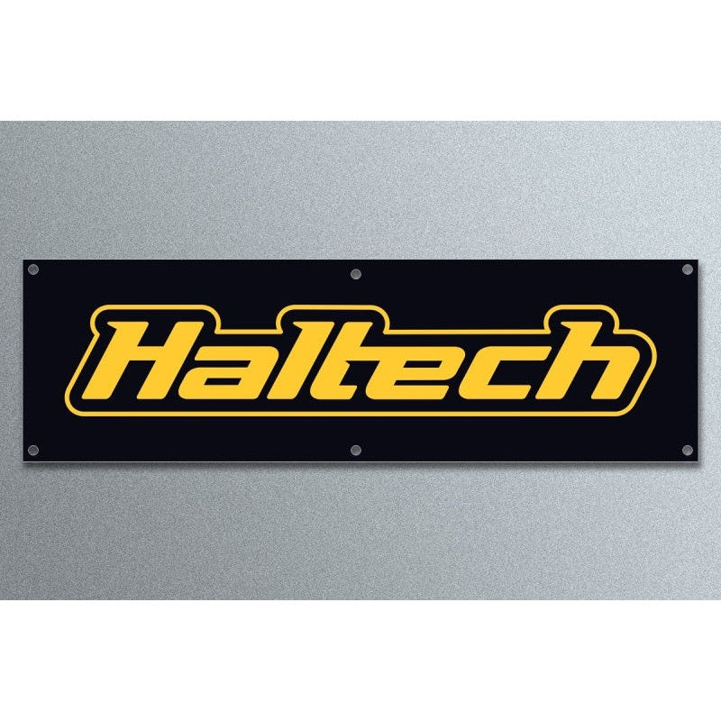 Large 2.4 meter Haltech logo banner made of durable black and yellow vinyl for outdoor workshop or trackside use.