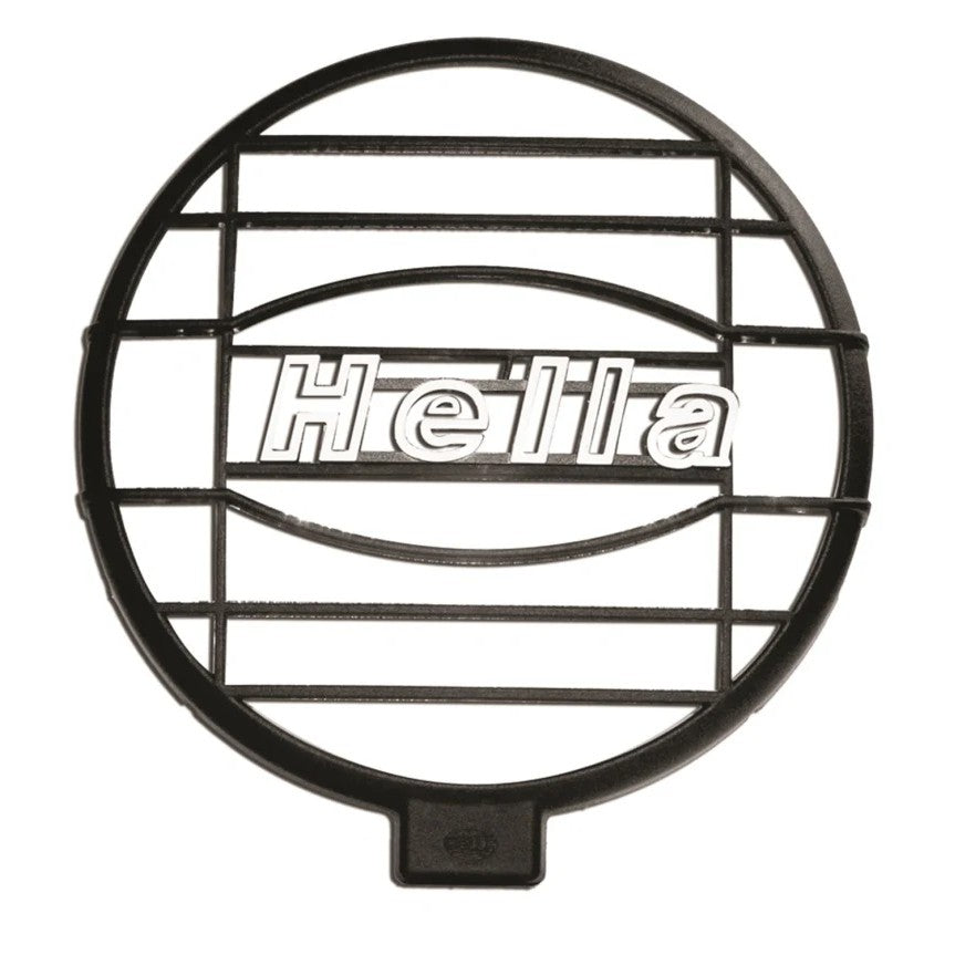 Pair of black Hella 500 Series protective lamp grille covers with horizontal slats for auxiliary driving lights.