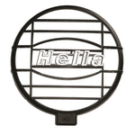 Pair of black Hella 500 Series protective lamp grille covers with horizontal slats for auxiliary driving lights.