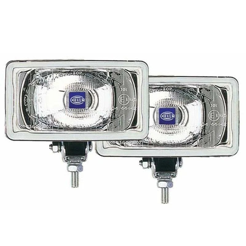 Rectangular Hella 550 Series halogen driving lamps with protective stone shields, wiring harness, and mounting hardware.