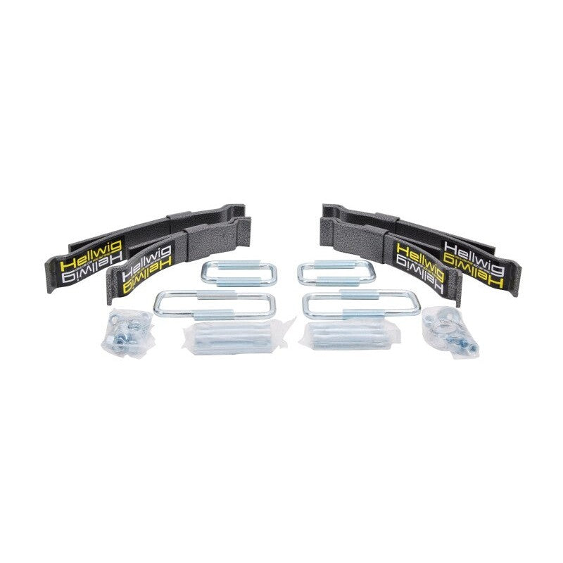 Hellwig Load Pro 15 black powder-coated steel helper spring kit with zinc-plated U-bolts and mounting hardware.
