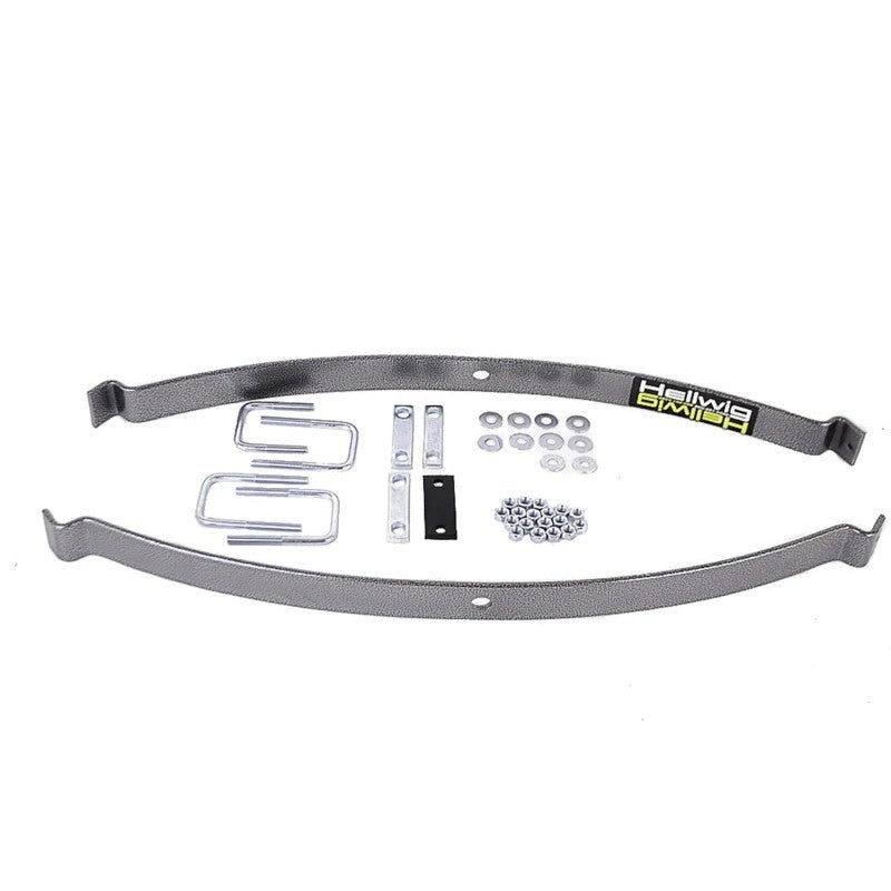 Hellwig EZ-990 medium-duty helper spring kit featuring powder-coated steel leaf springs, U-bolts, and mounting hardware.