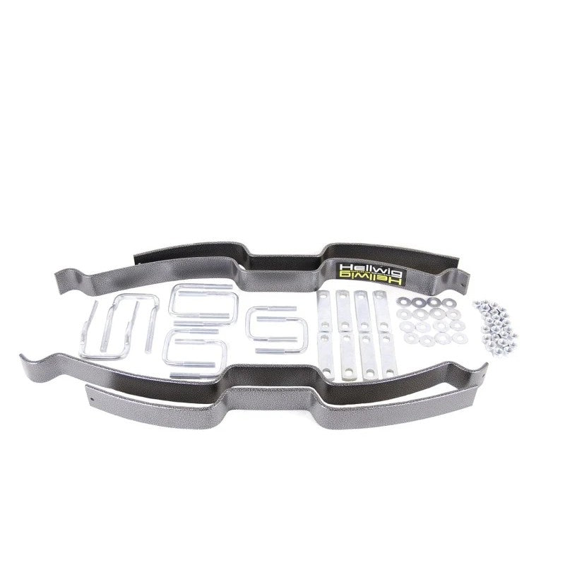 Hellwig Pro Series helper spring kit with heavy-duty steel leaf springs, U-bolts, and mounting hardware.