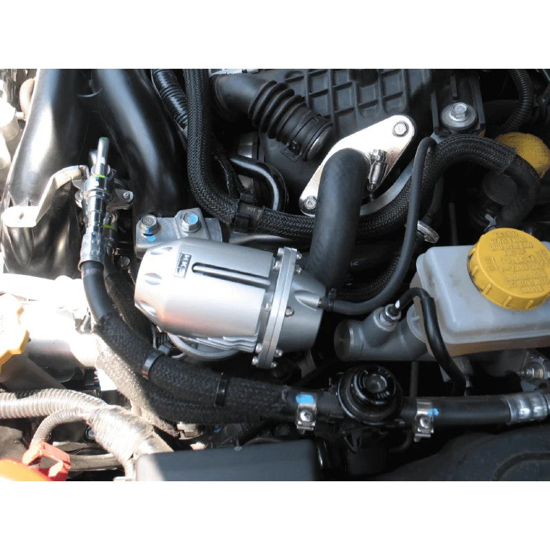 HKS Super SQV4 silver blow off valve with vehicle-specific mounting flange and hardware for Subaru WRX and Legacy 2.5GT