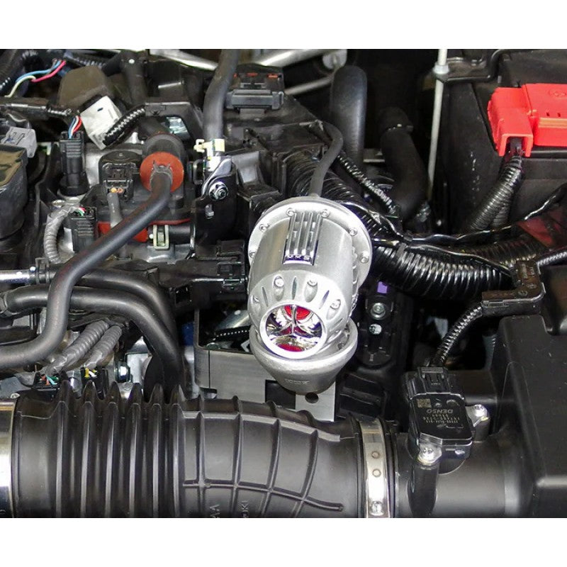 HKS Super SSQV4 silver blow off valve with triple fin insert and vehicle-specific mounting hardware for Honda L15 engines.