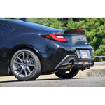 HKS Hi-Power SPEC-L dual exit exhaust system with carbon fiber wrapped tips and polished stainless steel piping