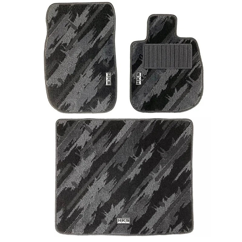 HKS DB#2 full set floor mats for LHD vehicles featuring the signature HKS oil color splash pattern on black carpet.