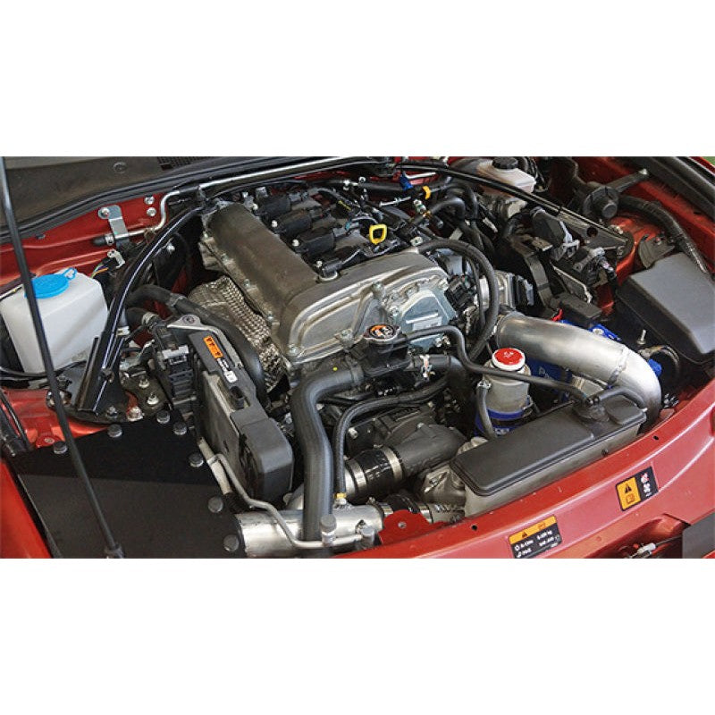 HKS GT2 centrifugal supercharger kit including intercooler, aluminum piping, and mounting brackets for Mazda MX-5.