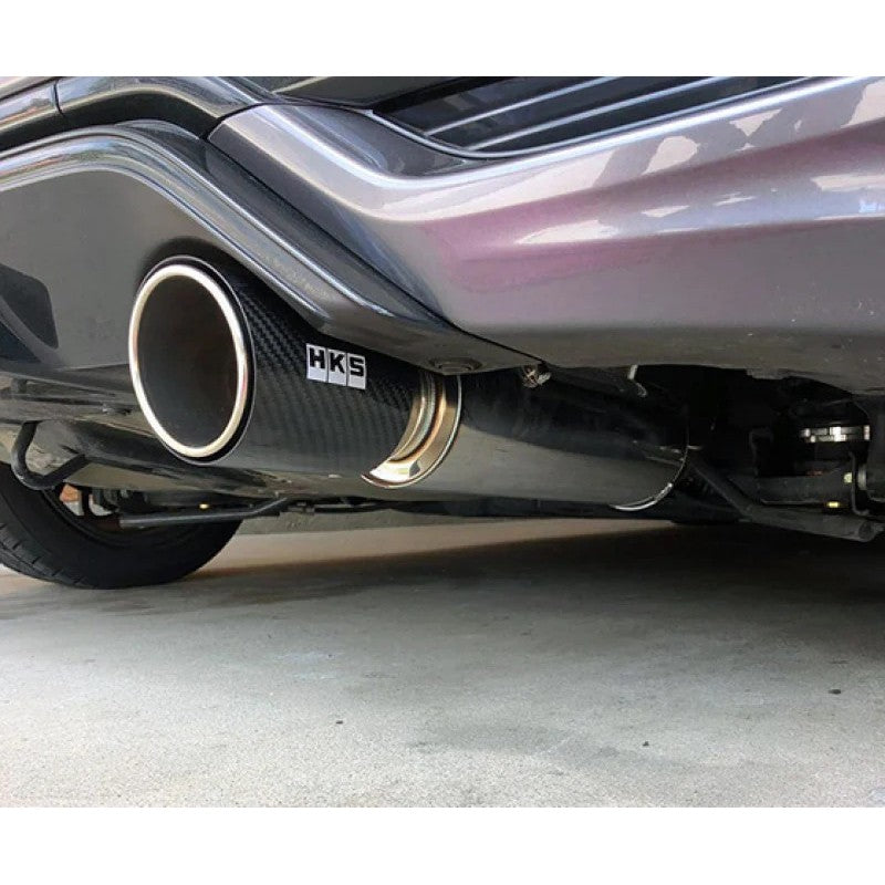 HKS Hi-Power exhaust muffler with a polished stainless steel canister and a carbon fiber exhaust tip.