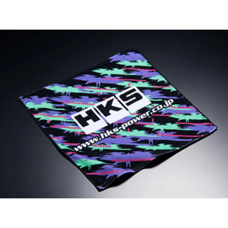 HKS hand towel featuring the signature purple, teal, and black Oilcolor splash pattern.