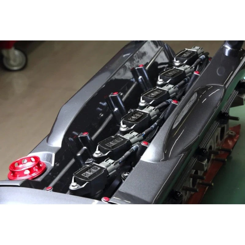 HKS Super Fire Racing Coil Pro ignition kit with red coils and mounting bracket for Nissan Skyline GT-R BCNR33