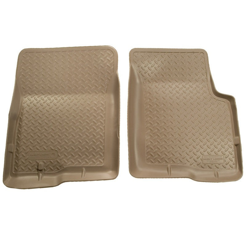 Tan Husky Liners Classic Style rubber floor mats for a 2000-2005 Ford Excursion