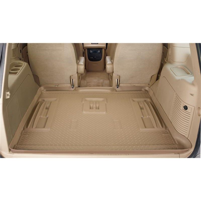 Tan Husky Liners Classic Style rear cargo liner for 2000-2005 Ford Excursion showing DuraGrip texture and raised UniEdge.