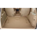 Tan Husky Liners Classic Style rear cargo liner for 2000-2005 Ford Excursion showing DuraGrip texture and raised UniEdge.