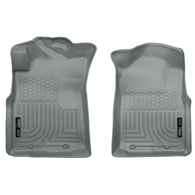 Husky Liners WeatherBeater front grey floor liners for 2005-2015 Toyota Tacoma, showing custom-fit textured surface.